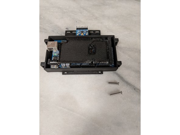 Place the Arduino Mega in the Arduino base so the USB lines up with the cutout of the base.