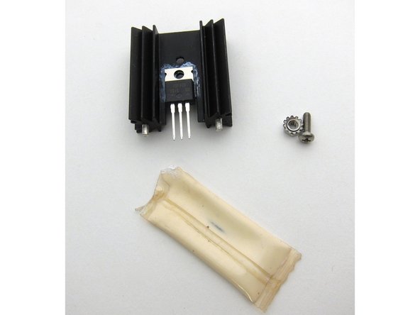 The heatsinks are not attached electrically to the PCB, you do not need to use insulators if your TO-220 devices have metal tabs. A bit of thermal grease is extremely helpful.  Align the device to he heatsink and snug on the screw, but do not make it tight yet.