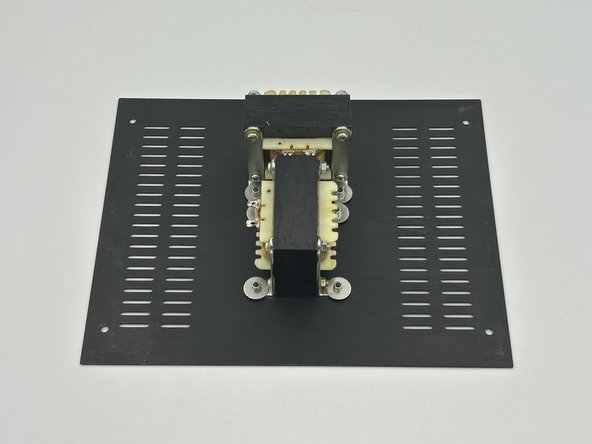 Mount the inductors to the bottom panel using black M3 x 10mm button head bolts, fender washers, and M3 lock nuts.