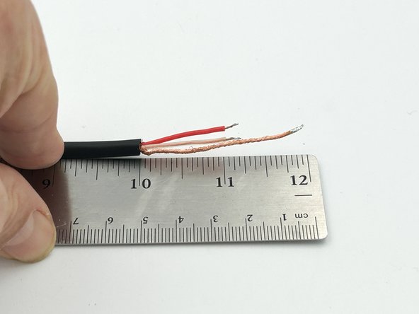 Strip off approximately 2&quot;(5cm) of the outer insulation from the input wire.  Cut off approximately 1&quot;(2.5cm) of the red and clear insulated conductors.  Strip approximately 1/8&quot;(3mm) from the red and clear insulation.  Twist and tin all wires.
