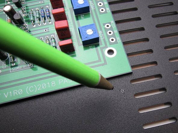 Use the PCB as a guide for drilling holes into the baseplate.