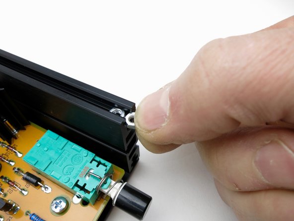 Front panel attached to side rails with black hex-head screws.