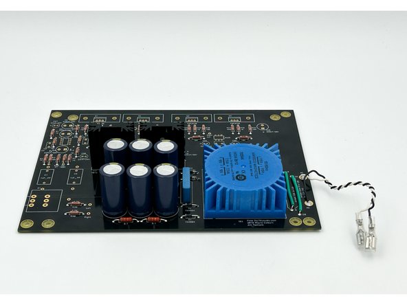 In the USA, black is typically used to designate the live wire carrying the current to the load.  White is typically used to designate the neutral wire providing the return path.  The neutral wire will typically be connected to mains earth within the building.