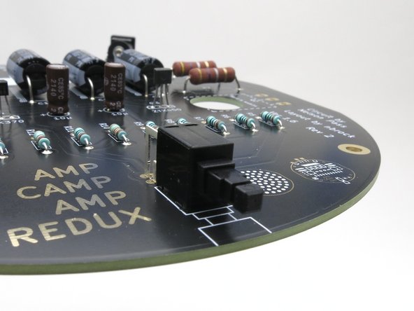 The round cap (not shown) is press fit on the switch.