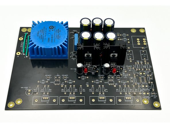 Identify one regulator assembly and slide it into the position marked U2 for the 7915 or U3 for the 7815.  Both 7915/7815 and U2/U3 are marked clearly on the silkscreen.  Double check it!