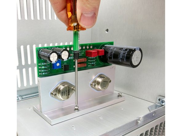Attach output stage to the heatsink.