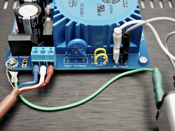 Connect mains wiring according to the build guide diagram.  Neutral (white wires in Photos 2&amp;3) from IEC to PCB.