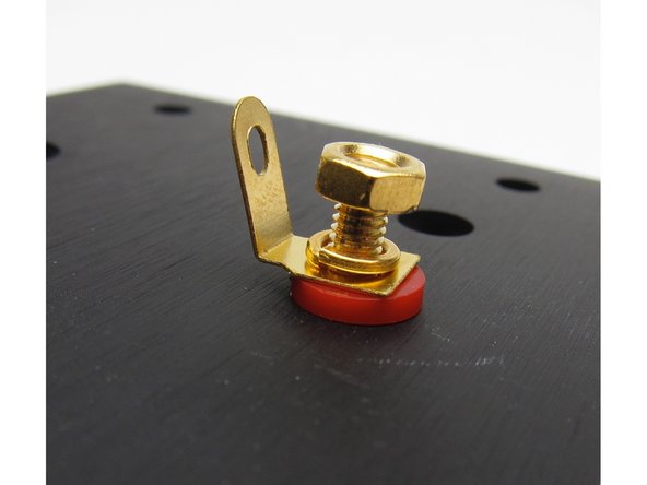 Install the binding posts with the tab pointing toward the middle of the chassis.