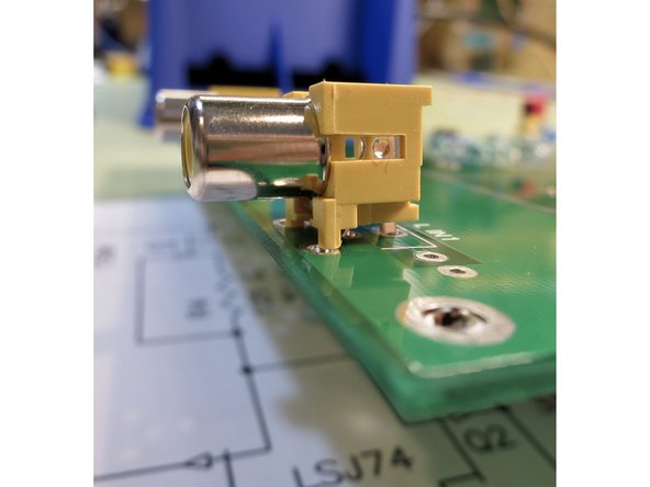 Photo 3 - Improper alignment. Make sure the jack is entirely flat on the PCB before soldering.