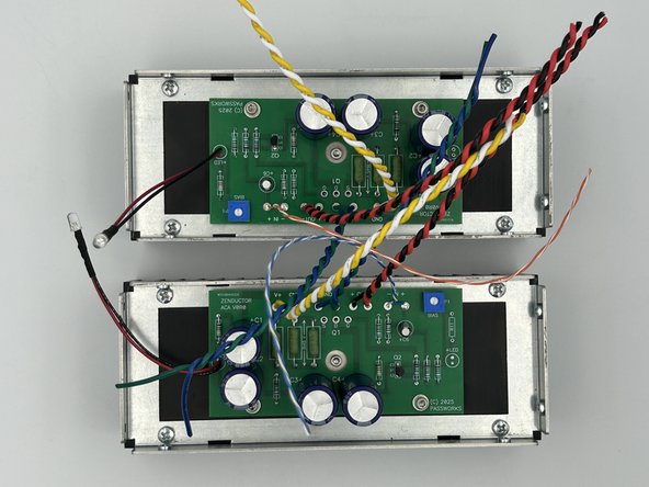 Gently slide the PCBs over the legs of the MOSFETs. Make sure that the LEDs are toward the front (away from the captured nuts on the heatsink rails).