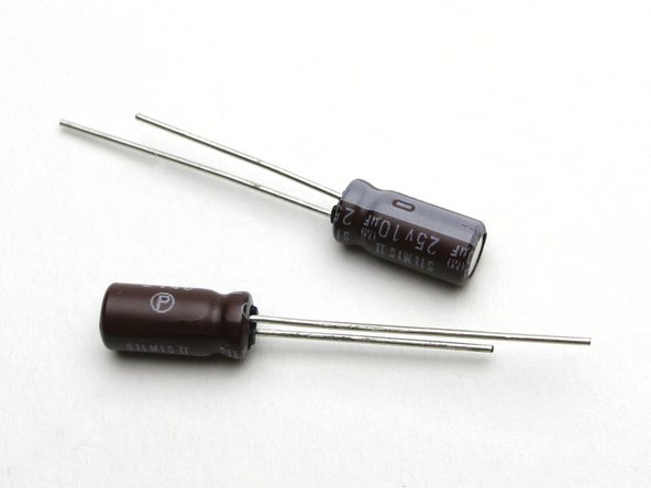 The smaller capacitors are 10uF, used in positions C3, C4.