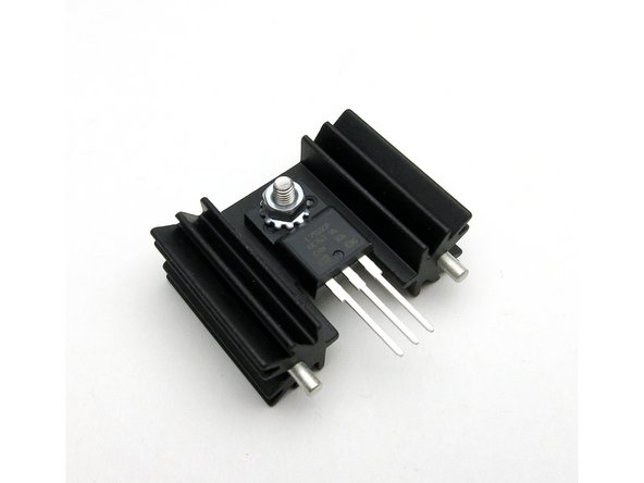 Mount heatsinks and regulators into PCB.  PAY ATTENTION to 7815 (Positive) and 7915 (Negative) markings on PCB and regulators.