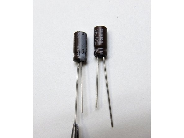 Capacitors have polarity - the long leg is Positive +, and the mark on the can shows negative -