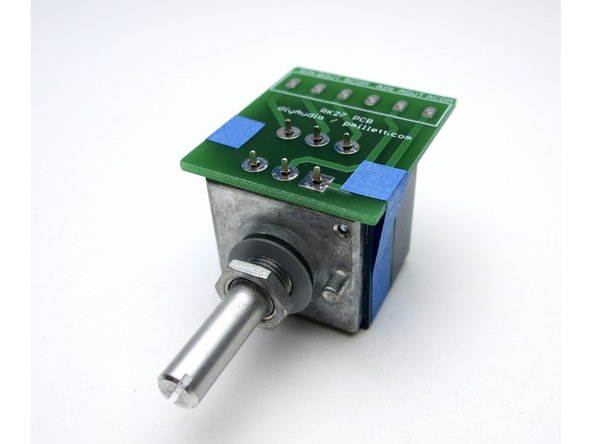 Photo 3 - A little tape helps keep everything in place when soldering the PCB.