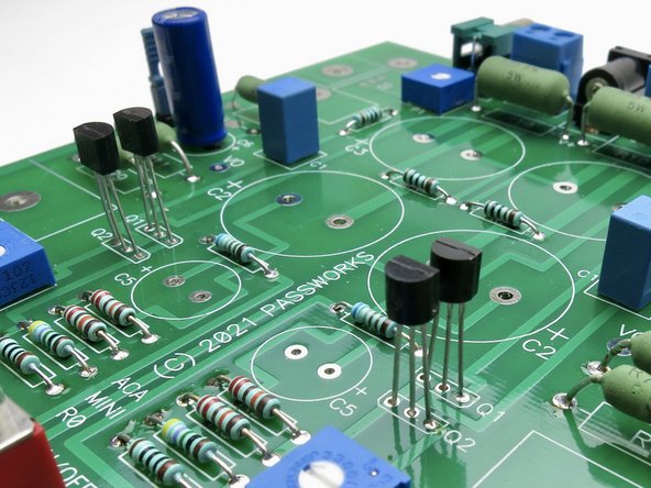 Stuff the small transistors. Watch the orientation, the flat of the device lines up with the flat drawn on the silk.