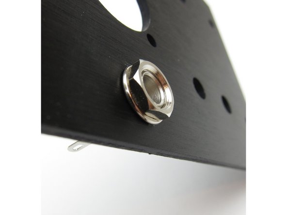 Second image: Lockwasher and nut on the outside of the chassis