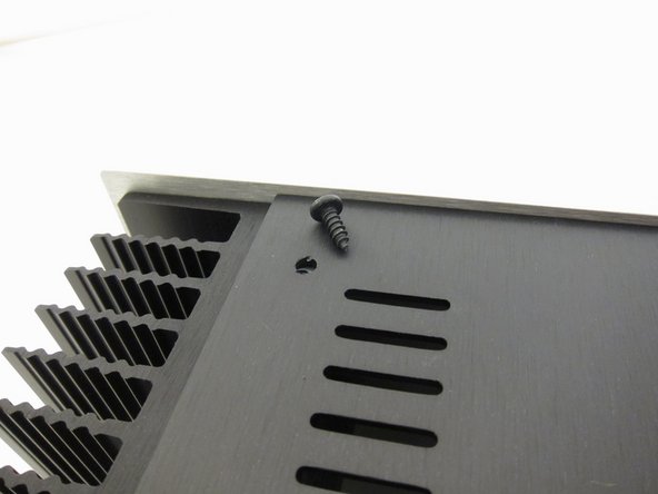 Sheet metal screws attach the top and bottom panels