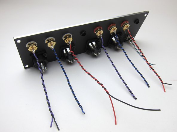The back panel was populated with 6 RCAs, the 2 supplied plugs in the other RCA holes, the barrel connector for power, and the XLR connectors were used to close those holes.