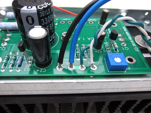 Photo 2 and 3 show input (from RCA) and wiring to speaker posts on the top edge.