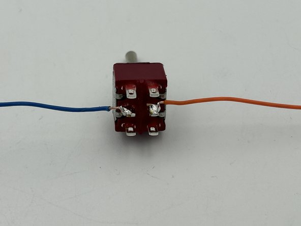 Take the two twisted pairs using the same colors as were wired previously to IN(+) and IN(-) and separate the solid-colored strands.from the white-striped strands.