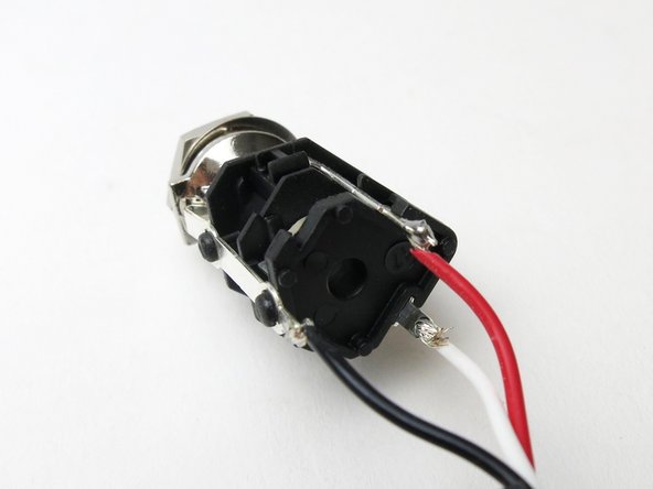 Photos of the headphone jack included in the parts kit.