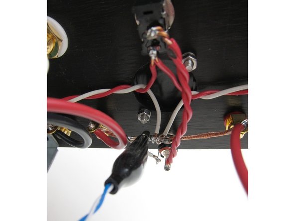 First image: Connect your DMM red lead to pin 2 of Q1