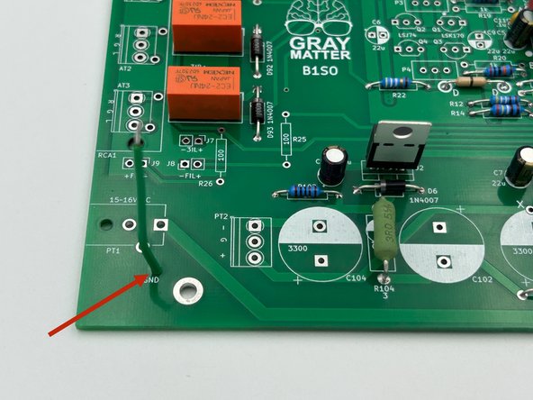 Strip approximately 1/8" (3mm) from each end of the green multistrand wire and tin both ends.