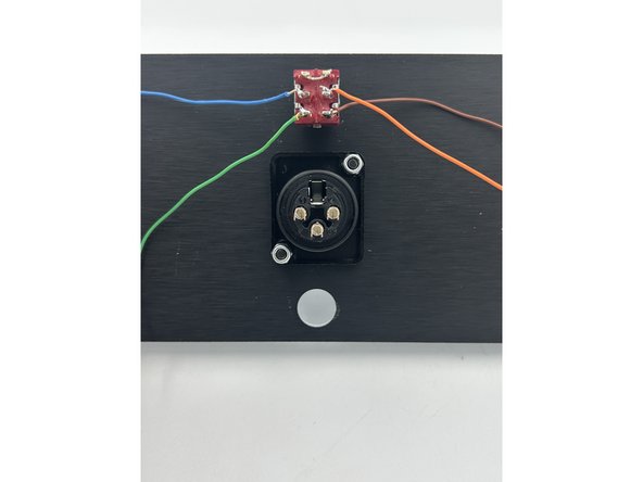 Install the XLR jack using M3 x 10 black button head bolts and M3 lock nuts.