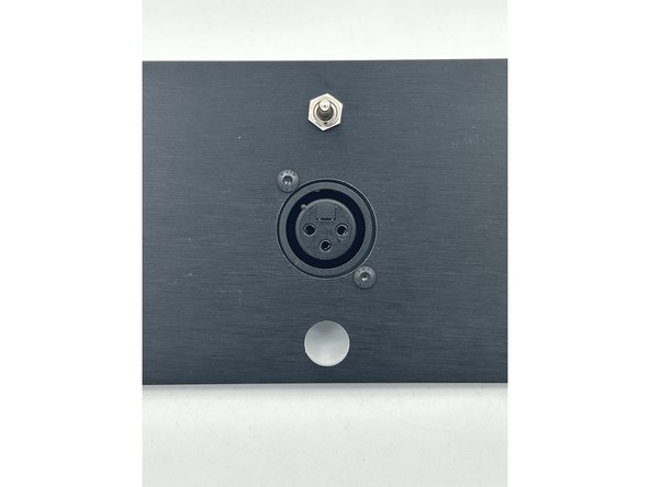 Install the XLR jack using M3 x 10 black button head bolts and M3 lock nuts.
