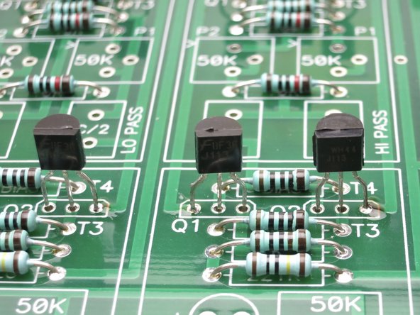 I like to insert the transistors and solder one leg from the top, this way you can get them mostly aligned, and then solder the rest of the leads from the bottom.
