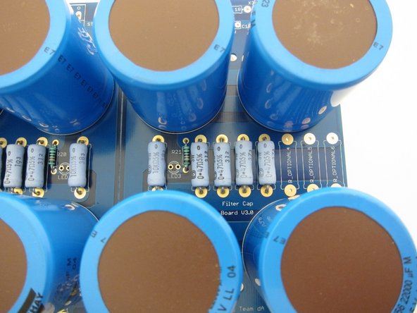 Photo 2) Filter resistors, bleeder resistor, LED resistor. LED not stuffed, choose whichever color you like,  you could color code V+ and V-, or make them bright blue to fill the vent holes with color, it's up to you.