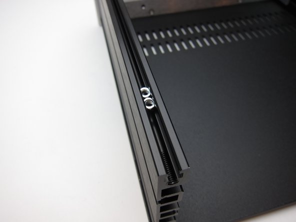 Insert the nuts in to the extrusion before attaching the back panel.
