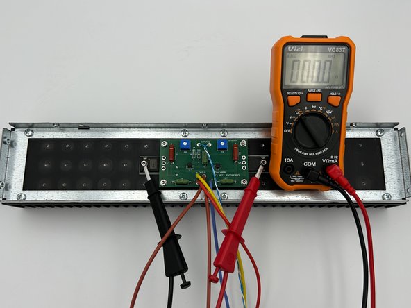 It is critical to check the resistance from the heatsink (chassis / mains earth) to each pin of the MOSFETs prior to soldering them into place.  The metal back of the MOSFET is the drain, and it must be electrically isolated from the heatsink.