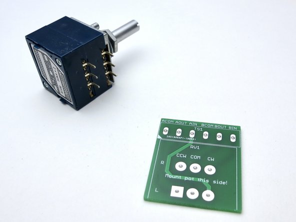 Photo 3 - A little tape helps keep everything in place when soldering the PCB.