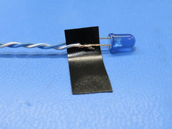 Cut positive LED lead (longer lead / Anode) and solder wire to PCB.  Note which color is positive!