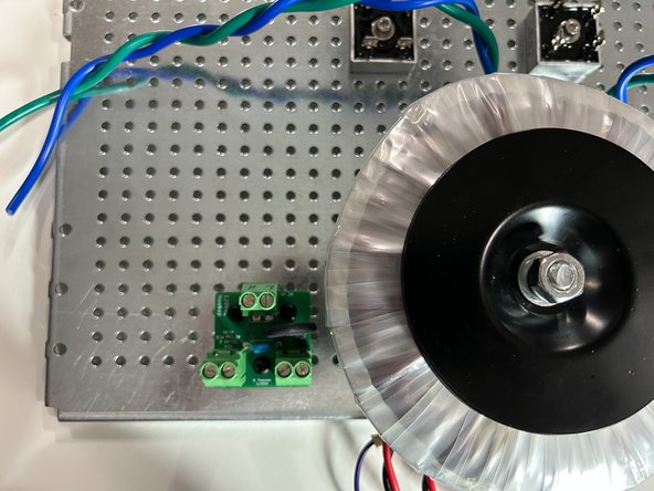 Mount your Mains AC Hookup board to your perforated base plate using the nuts, bolts and nylon spacers included in your kit.  Adding a split washer is advised.  It is critical that no wire-ends or leads make contact with the perforated baseplate.