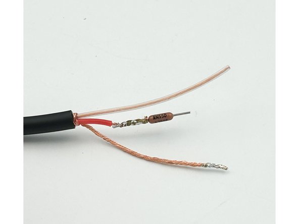 Strip approximately 2&quot;(50mm) of the outer insulation from the non-connected end of the pre-amp input wire.  Twist and tin the bare-wire conductor.  Strip the red and clear insulated conductors leaving a few mm of insulation remaining.
