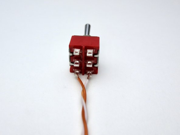 Photo 1 - Solid colors on the left, white traces on the right. Begin with orange on the bottom. Note that there is no &quot;top&quot; or &quot;bottom&quot; to the switch until you attach things to it.