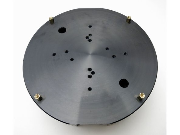 Screw the 4 brass standoffs into the outermost holes along the heatsink.