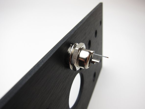 First image: split (lock) washer under the nut