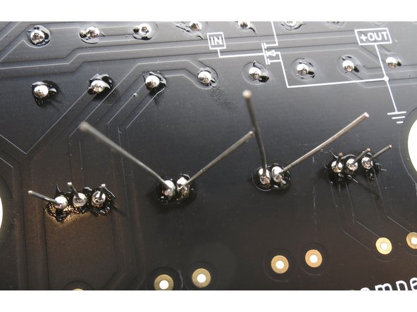 The transistors have 3 solder pads each, the capacitors have 2.