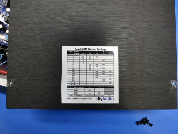 Place sticker on inside of the top panel.