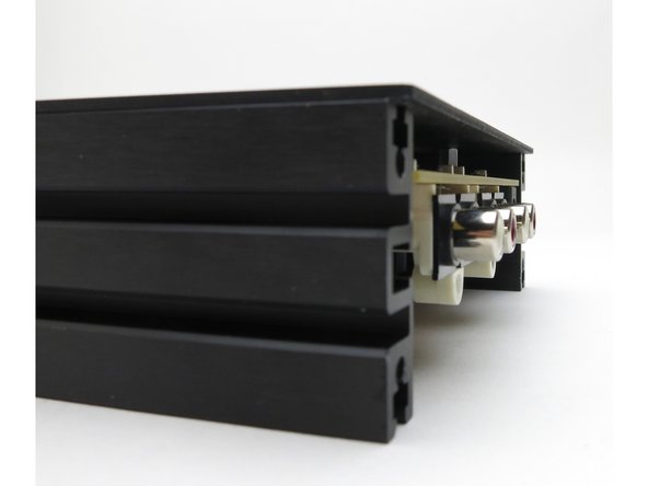 The PCB will be slightly behind the side rails, and the top plate will hang over both the PCB and rails.