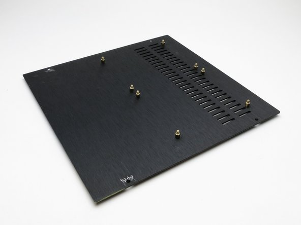 Purchase M3x5 standoffs and attach as shown. The vent holes are at the front of the chassis.