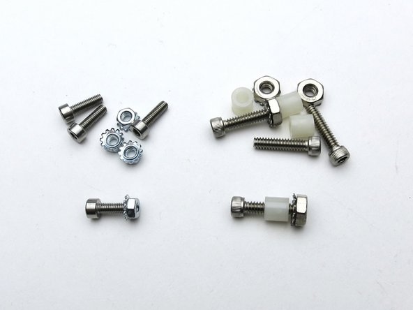 Screw from bottom, spacer in-between, nut on top.