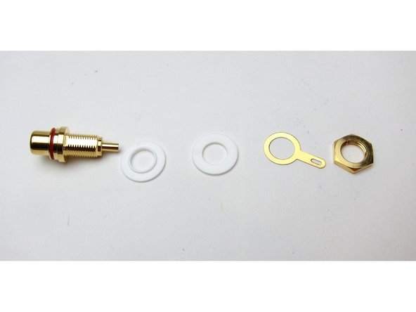 Tip - The RCA Jacks Ship with the components in a different order than implemented in this build. Pay attention to the GND tab in relation to the chassis and the plastic insulator.  The GND tab should be separated from the chassis. See photo 1 for the proper order.  Note - there is one additional hex nut to be installed.