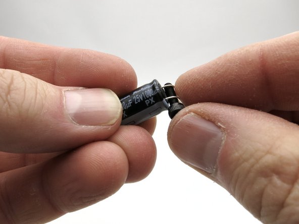 The leads of the 1000uF capacitors need to be bent down before installation.