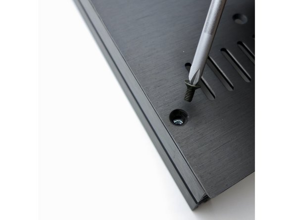 Slide the nuts under the holes then attach the screws