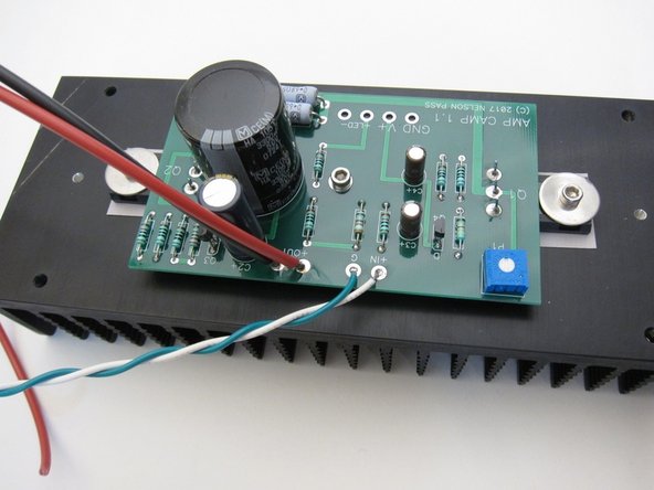 Use some of the red (+) and black (-) wire for the speaker outputs, and twist the green (-) and white (+) together for the input.