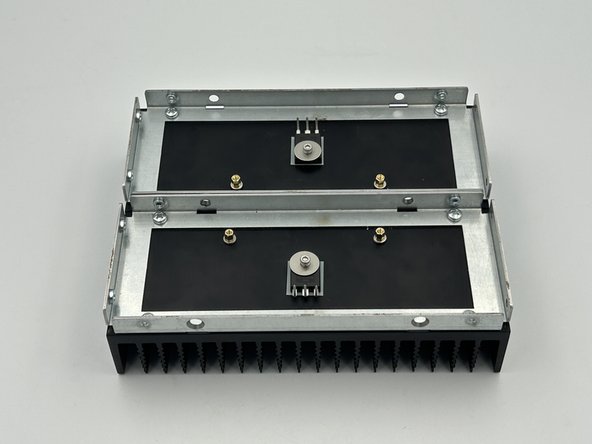 Align the MOSFET with the insulating pad.